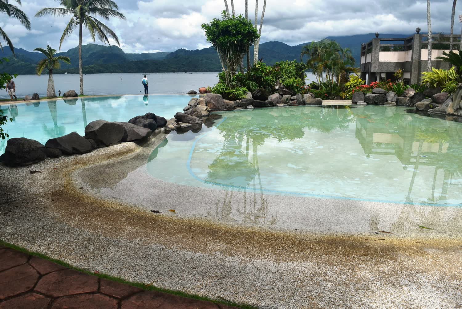 An infinity pool merging into the sea horizon at a hillside resort near Koh Tao